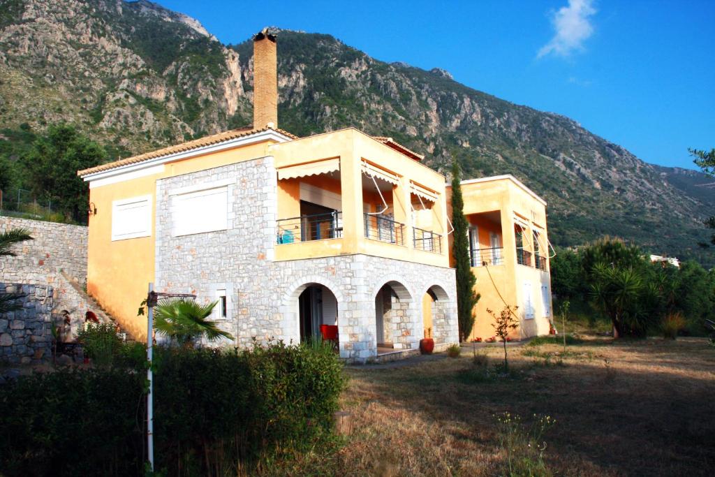 a house in front of a mountain at Sea and Mountain View in Kalamata