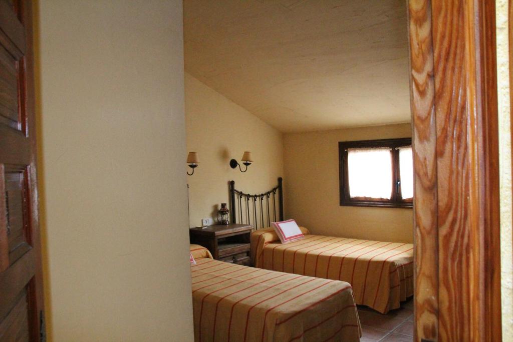 A bed or beds in a room at Casa Rural Celtia