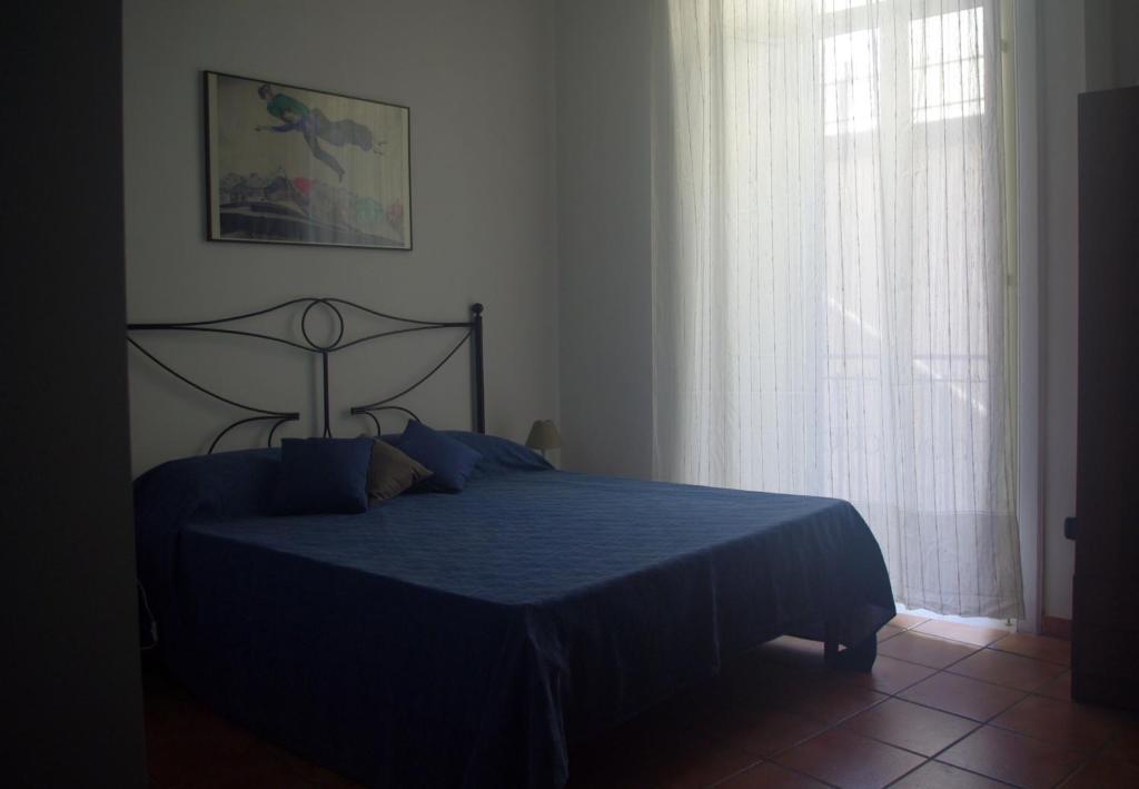 A bed or beds in a room at 'Na Siesta