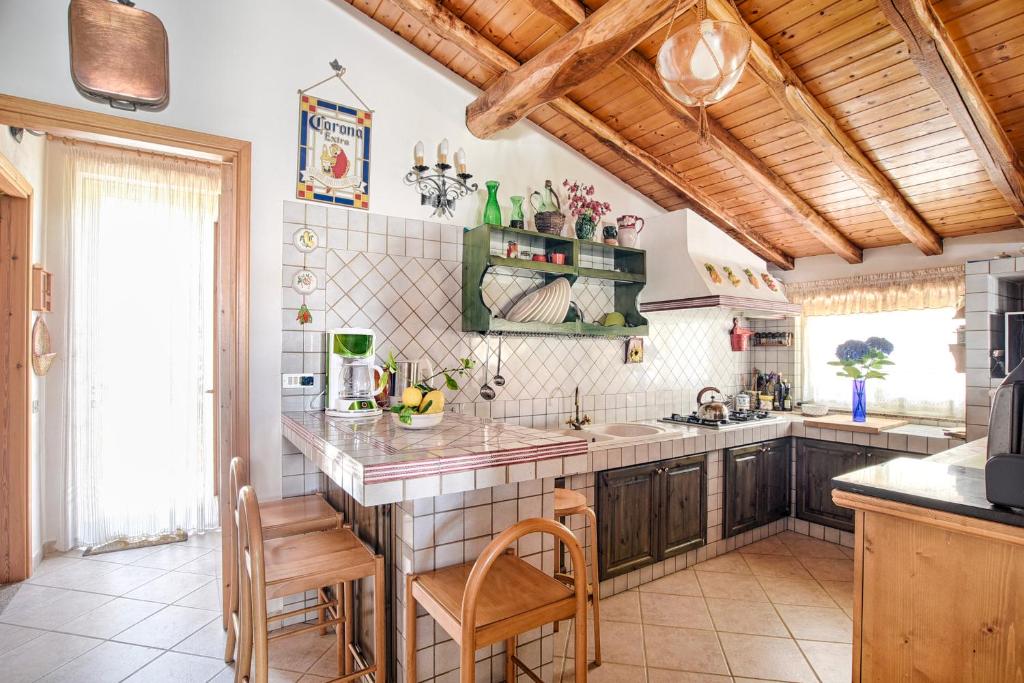 a kitchen with a sink and a counter top at Casa Clò in Trecastagni