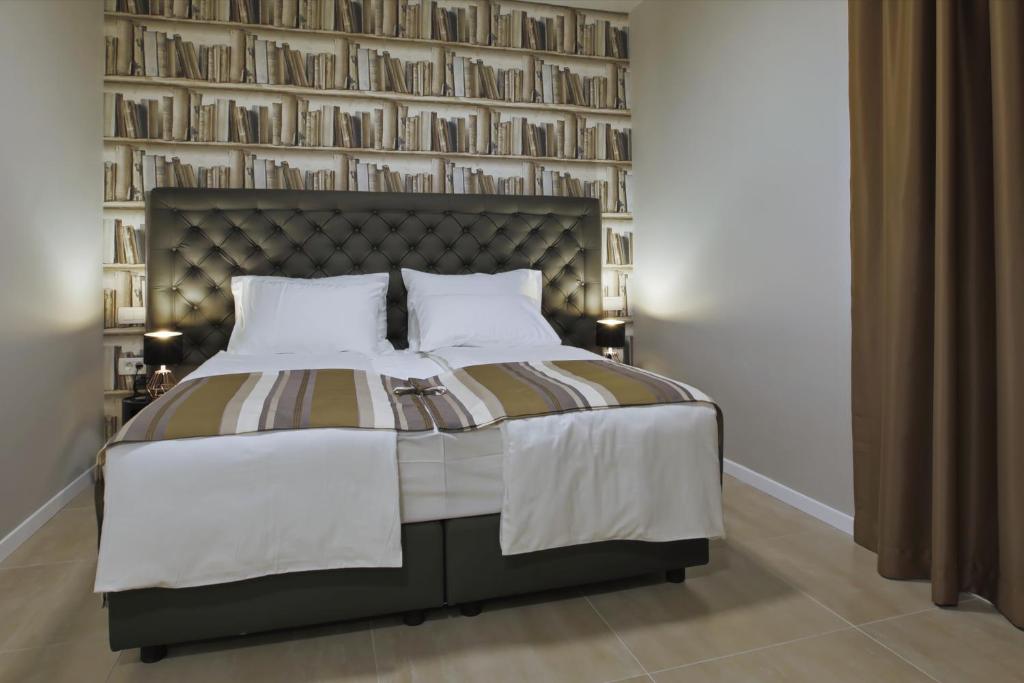 Posteľ alebo postele v izbe v ubytovaní Spalato Luxury Rooms