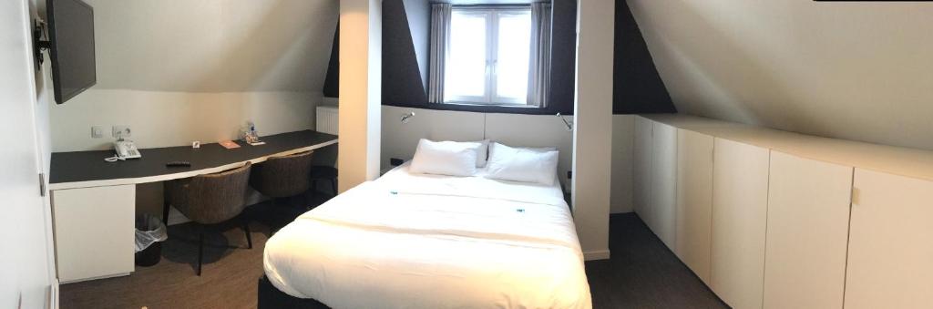 Postel nebo postele na pokoji v ubytování Hotel Astel