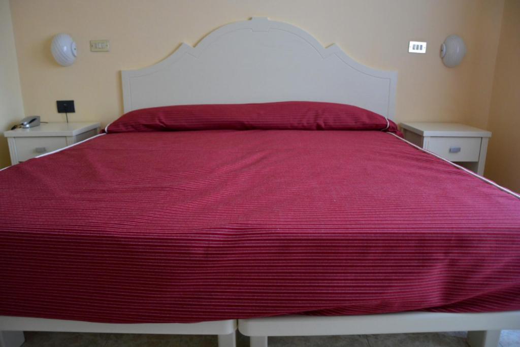 Postel nebo postele na pokoji v ubytování Hotel Giotto