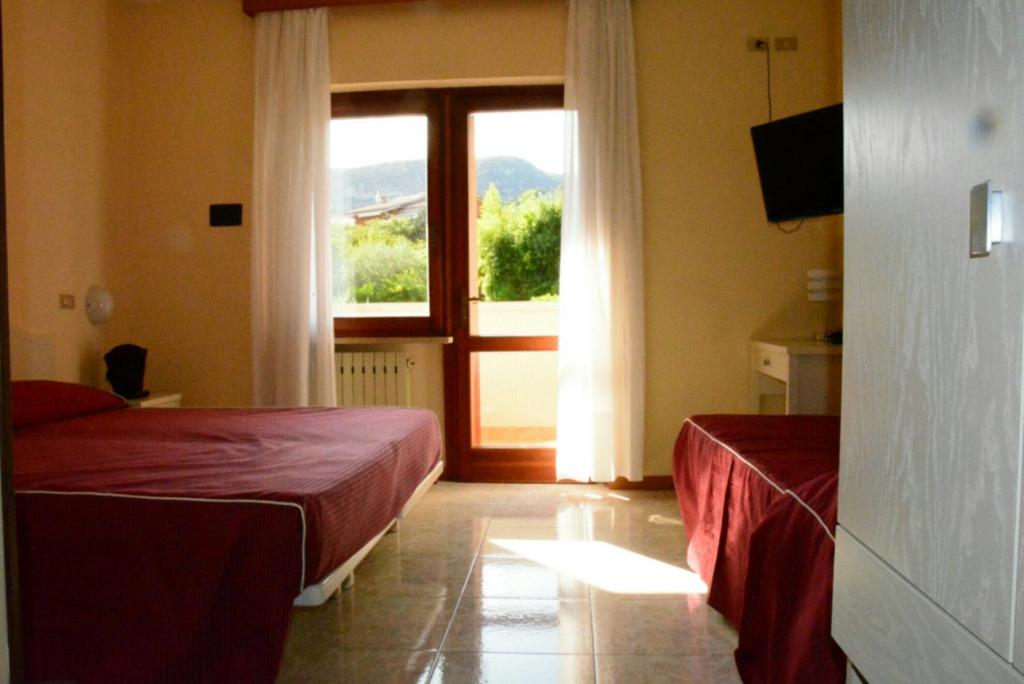 Postel nebo postele na pokoji v ubytování Hotel Giotto