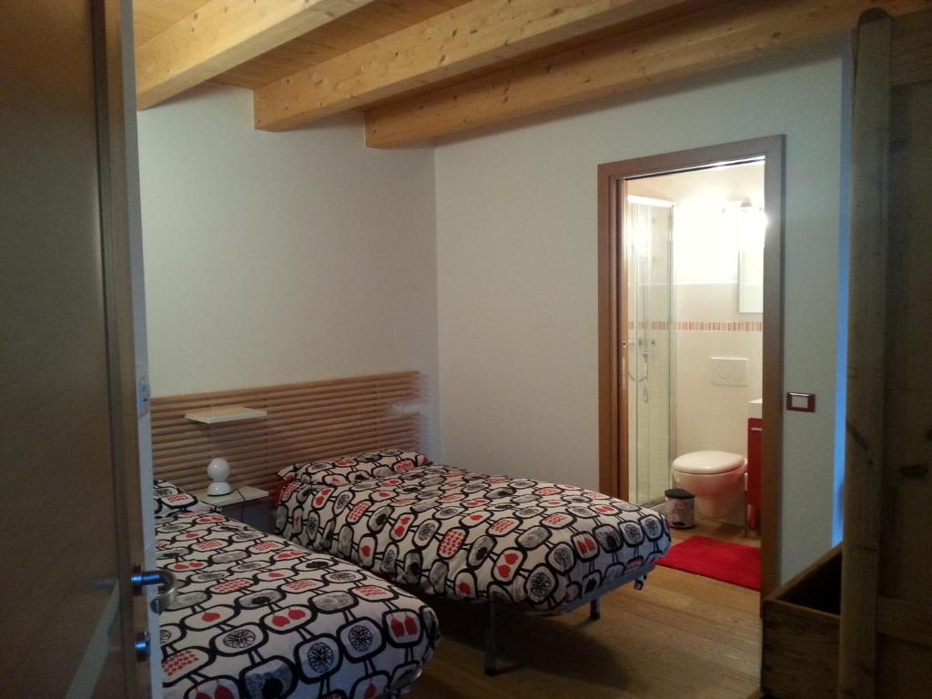 Postel nebo postele na pokoji v ubytování B&B Al Gatto Nero