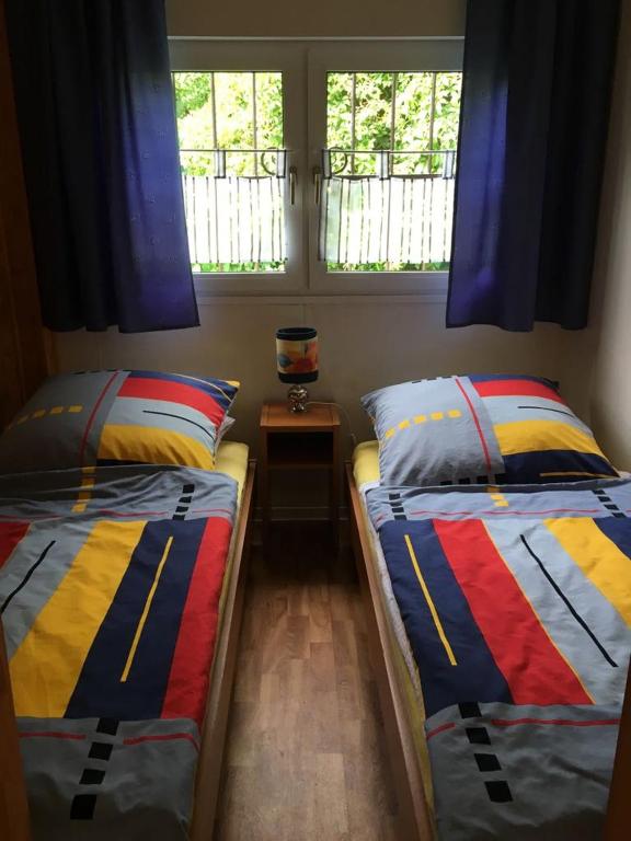 Posteľ alebo postele v izbe v ubytovaní Bungalowfarm