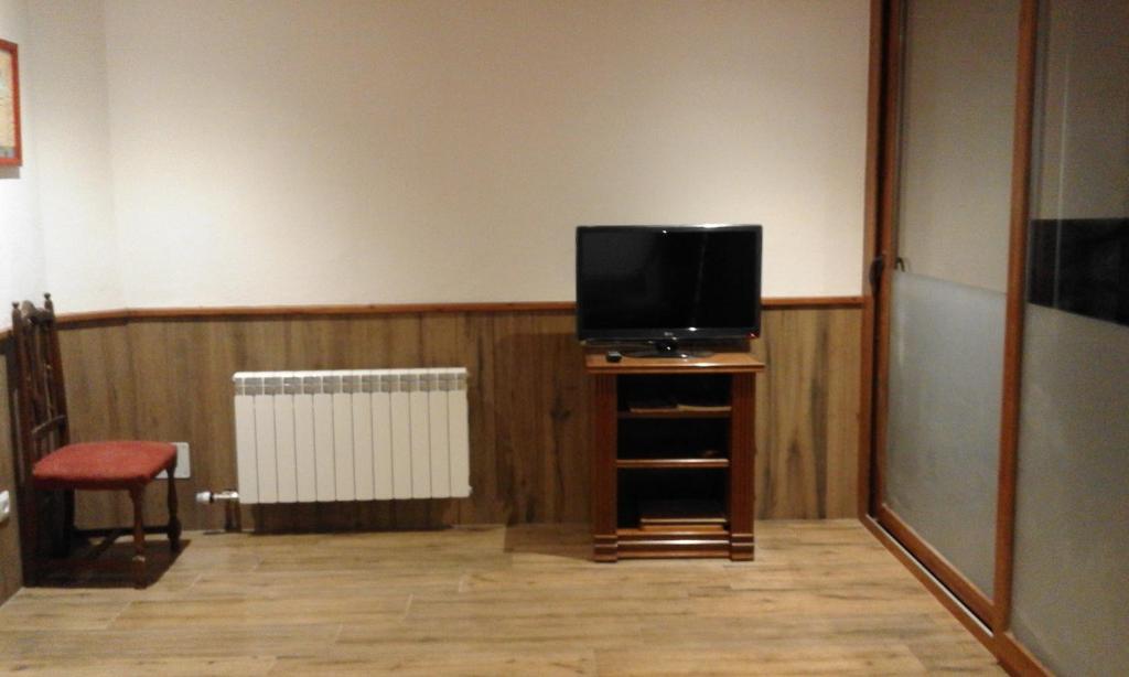 TV a/nebo společenská místnost v ubytování Allotjament Taga