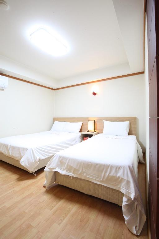 Postel nebo postele na pokoji v ubytování Angel Hotel