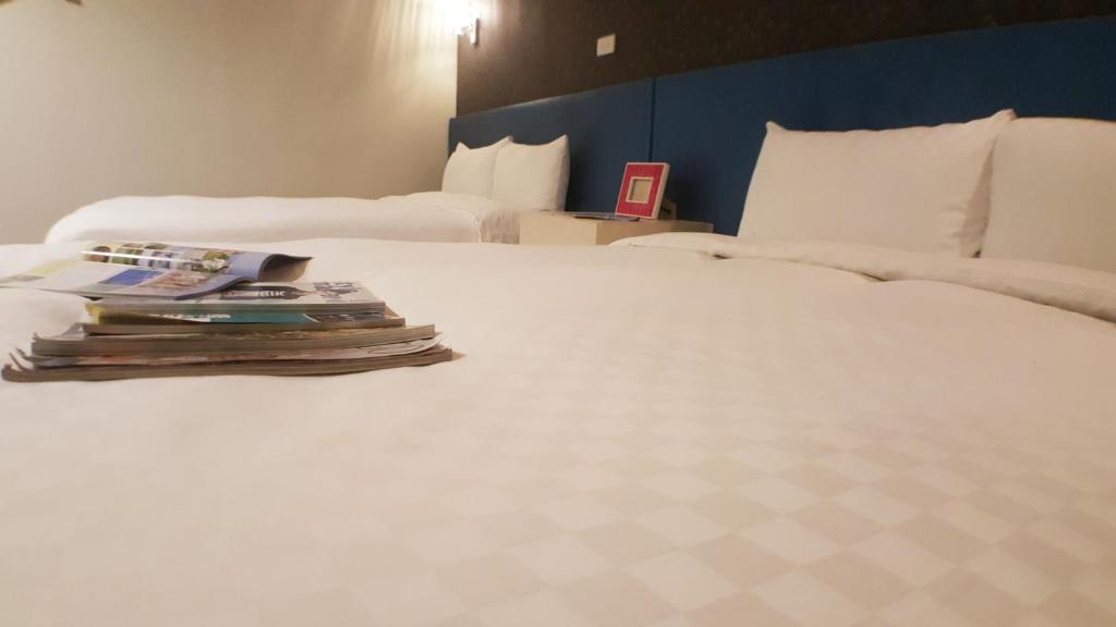 Postel nebo postele na pokoji v ubytování Walker Hotel - Zhengyi