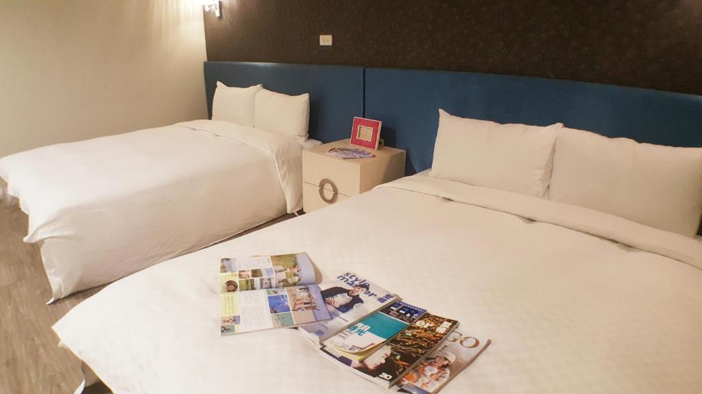 Postel nebo postele na pokoji v ubytování Walker Hotel - Zhengyi