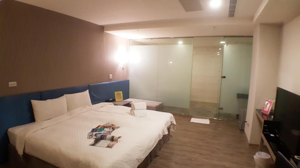 Postel nebo postele na pokoji v ubytování Walker Hotel - Zhengyi