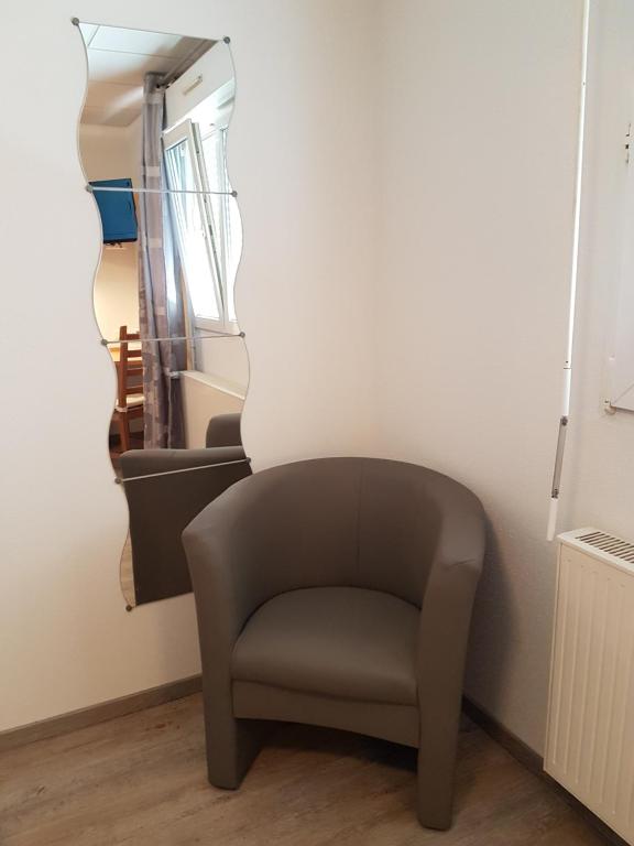 Posezení v ubytování Hôtel Des Bois