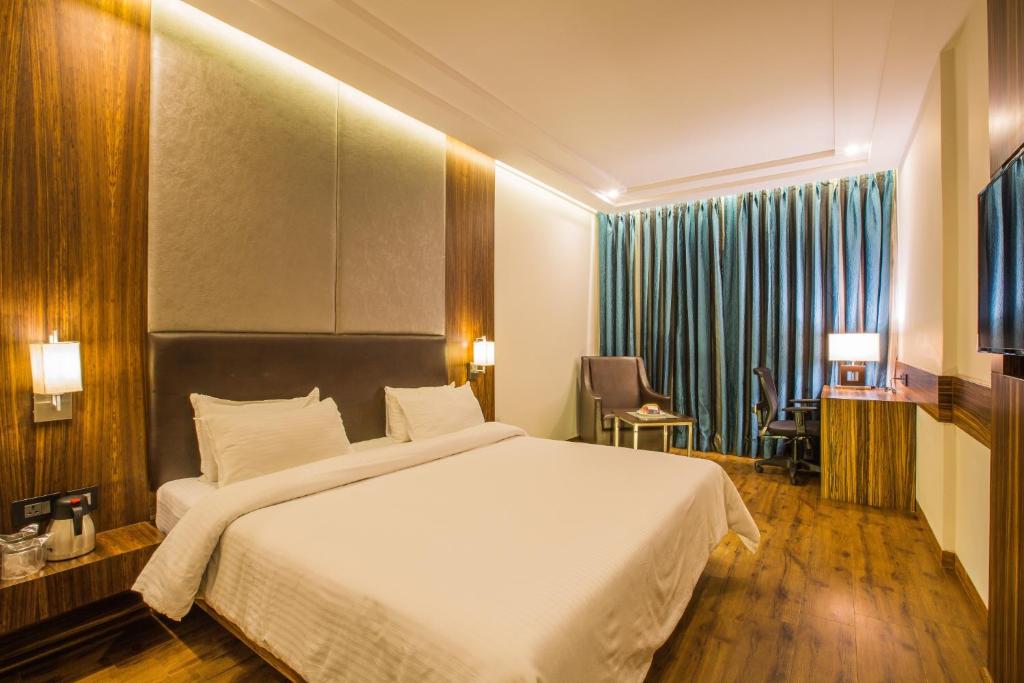 Postel nebo postele na pokoji v ubytování Hotel Hemala