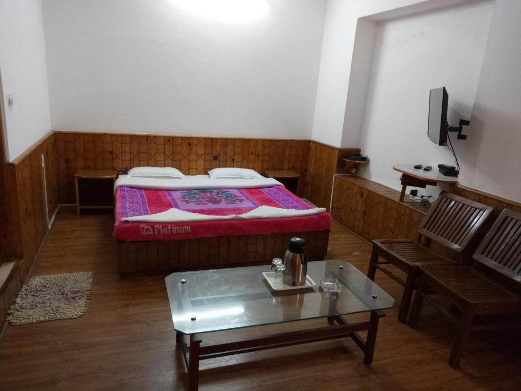 Postel nebo postele na pokoji v ubytování Dragon Inn