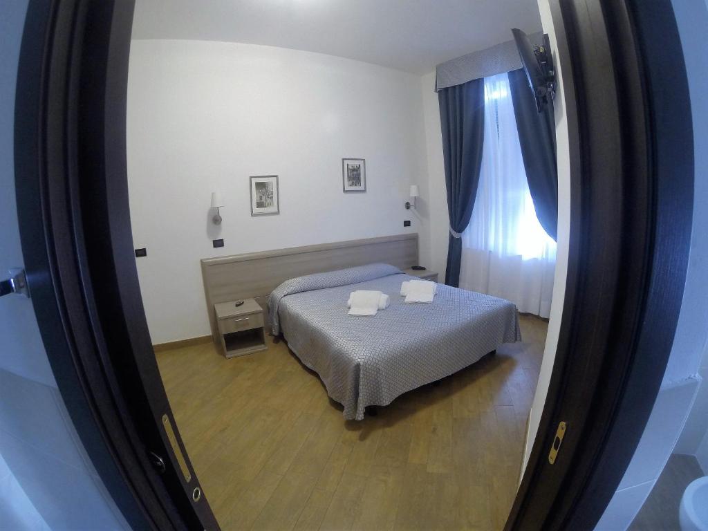 Postel nebo postele na pokoji v ubytování Hotel Chopin