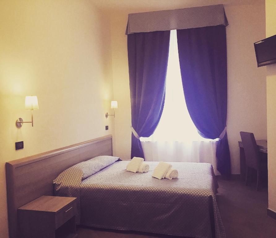 Postel nebo postele na pokoji v ubytování Hotel Chopin