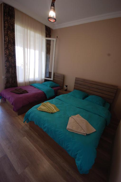 Llit o llits en una habitació de Guest House Aisi