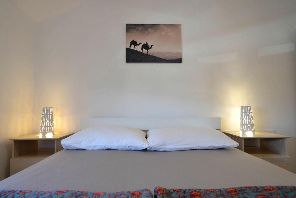 Posteľ alebo postele v izbe v ubytovaní EnVi Apartments