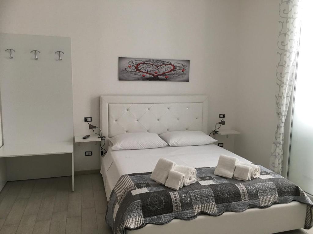 Postel nebo postele na pokoji v ubytování B&B ARCHIMEDE