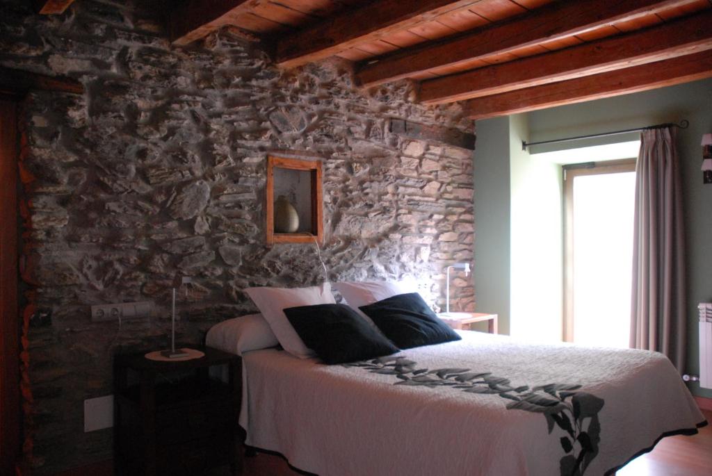 Postel nebo postele na pokoji v ubytování Masia d'en Valentí
