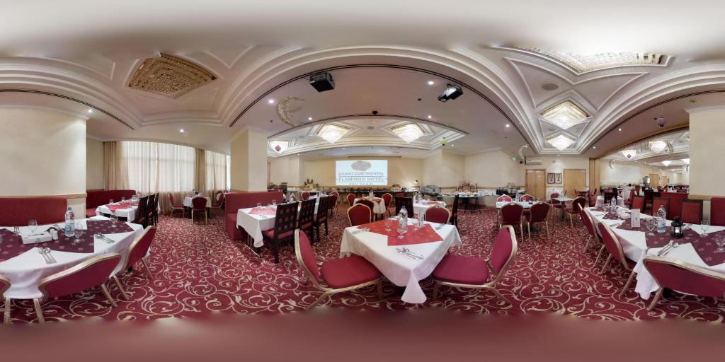 Reštaurácia alebo iné gastronomické zariadenie v ubytovaní Grand Continental Hotel