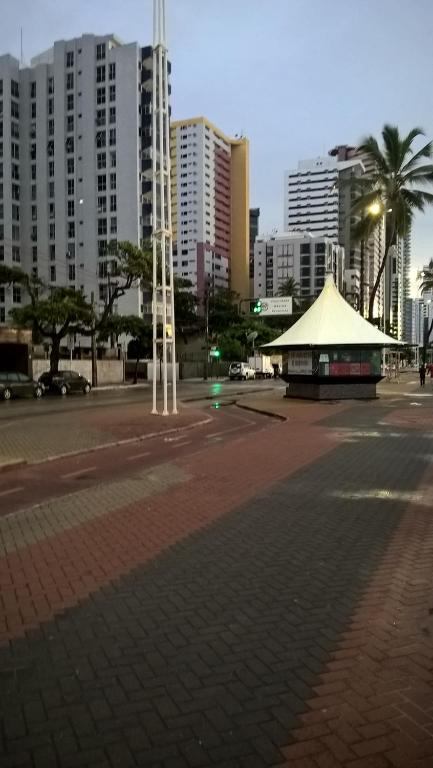 a building in a city with tall buildings at Boa Viagem Flat BVF 777 in Recife