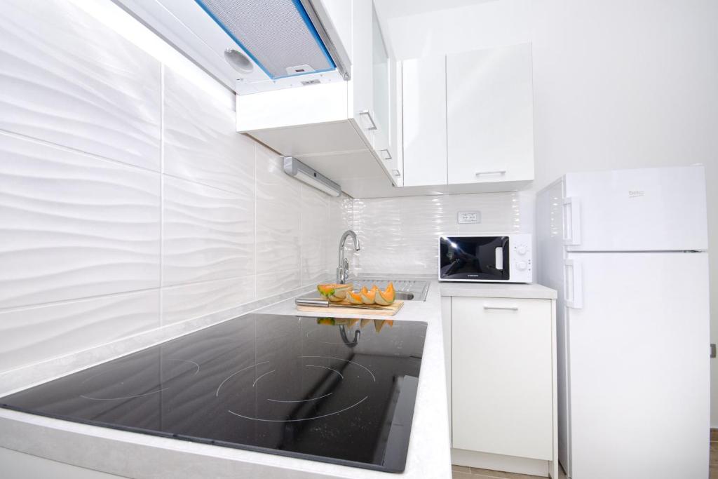 Kuchyňa alebo kuchynka v ubytovaní Apartments Keli