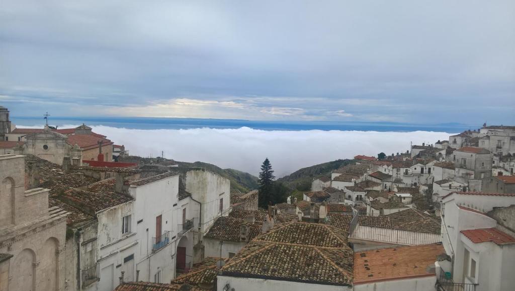 a view of a city with clouds in the background at B&B Michael in Monte SantʼAngelo