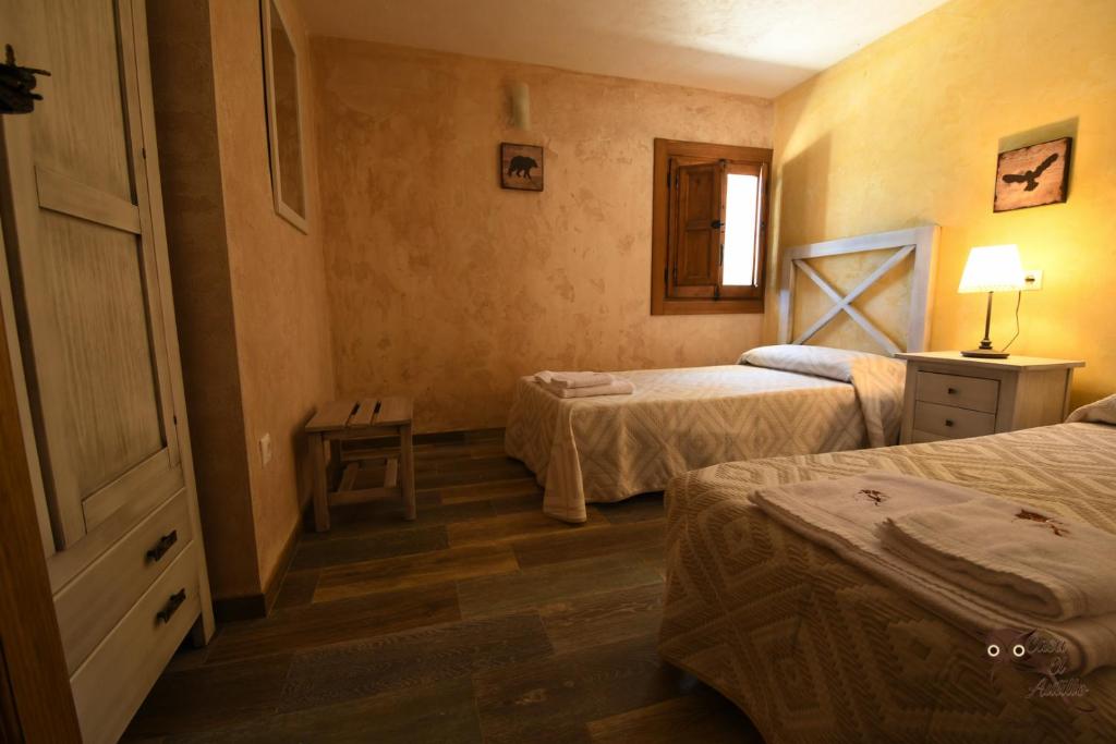 A bed or beds in a room at Casa el Autillo l