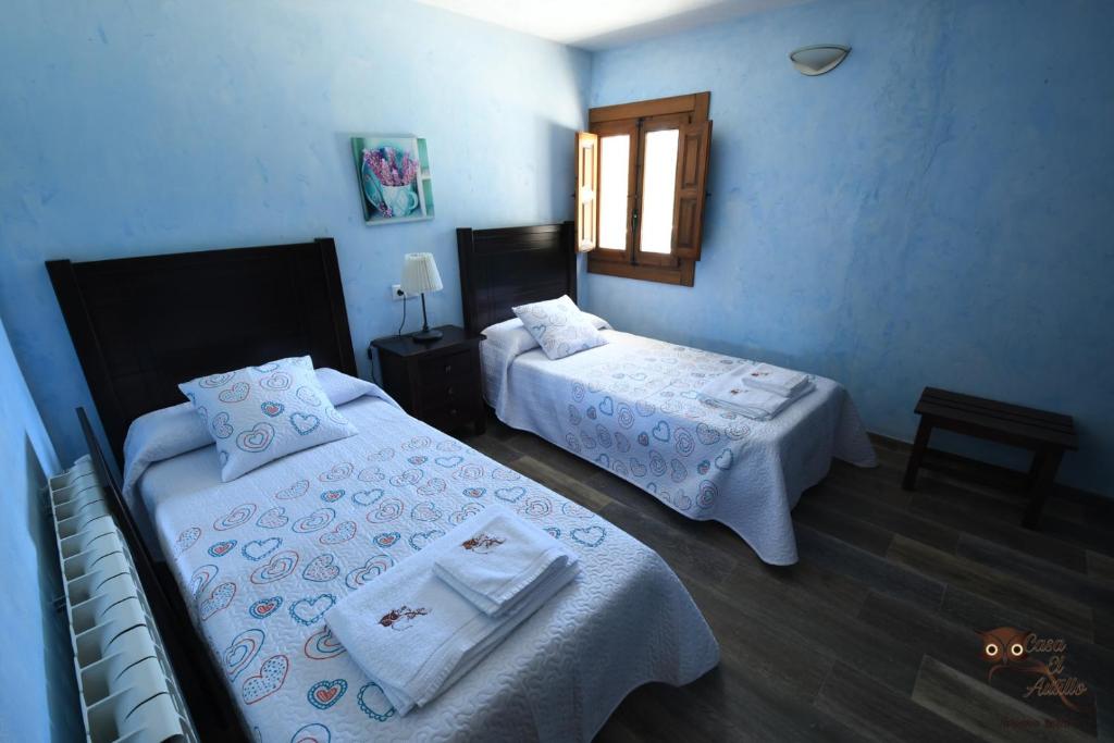 A bed or beds in a room at Casa el Autillo l