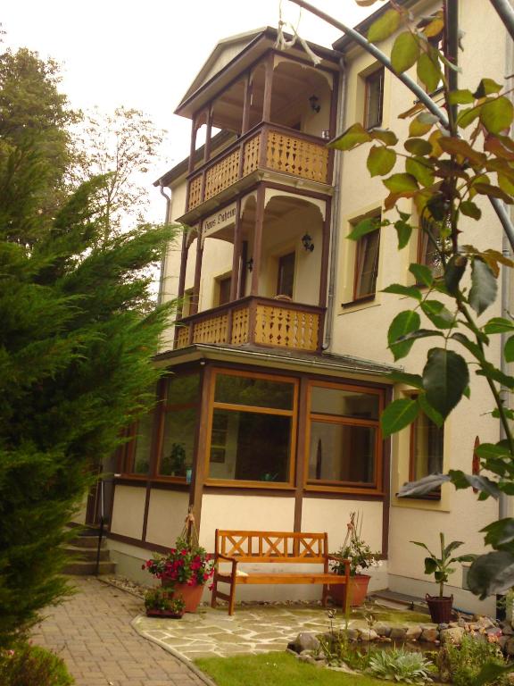 a large building with a bench in front of it at Haus Daheim in Bad Schandau