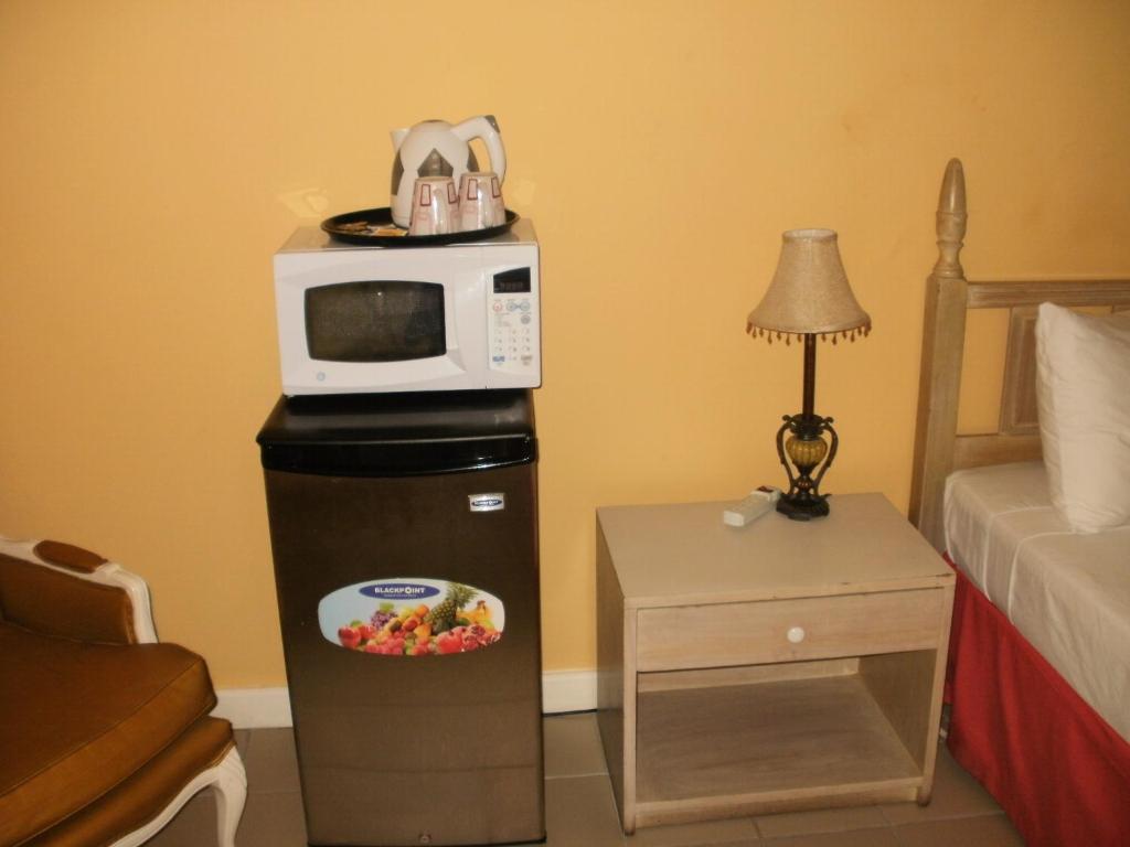 Kuchyň nebo kuchyňský kout v ubytování Pineapple Court Hotel