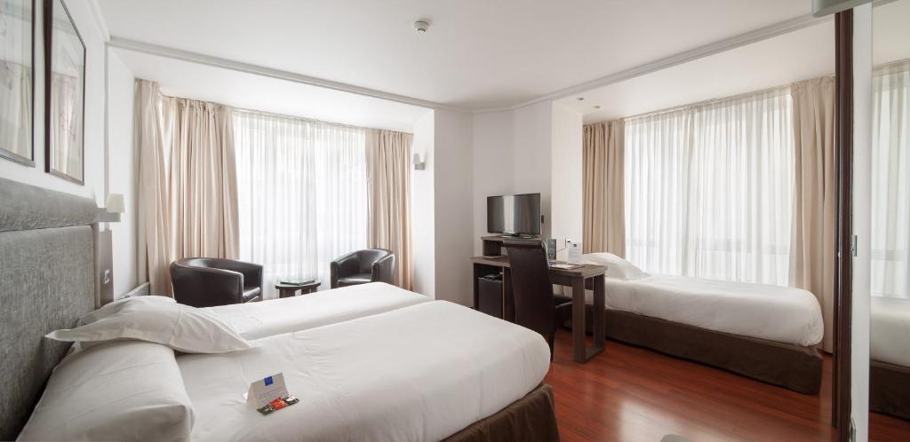 Postel nebo postele na pokoji v ubytování Hotel Yoldi