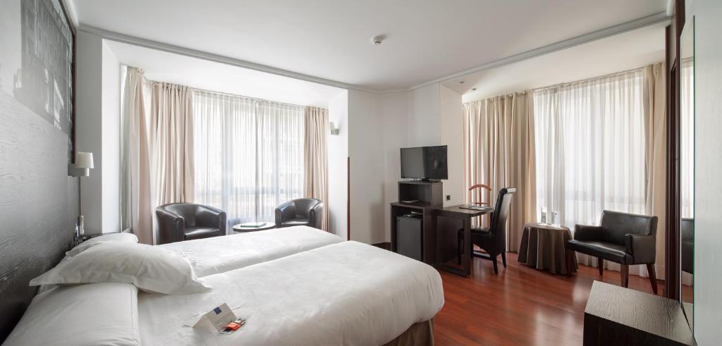 Postel nebo postele na pokoji v ubytování Hotel Yoldi