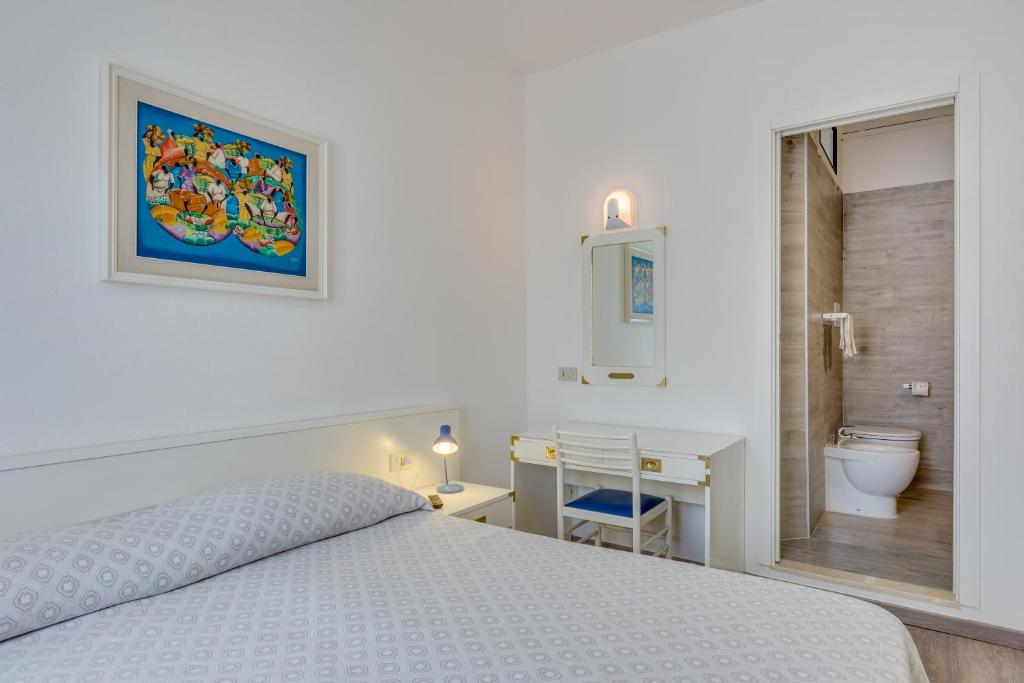 Postel nebo postele na pokoji v ubytování Hotel Garni' Serena