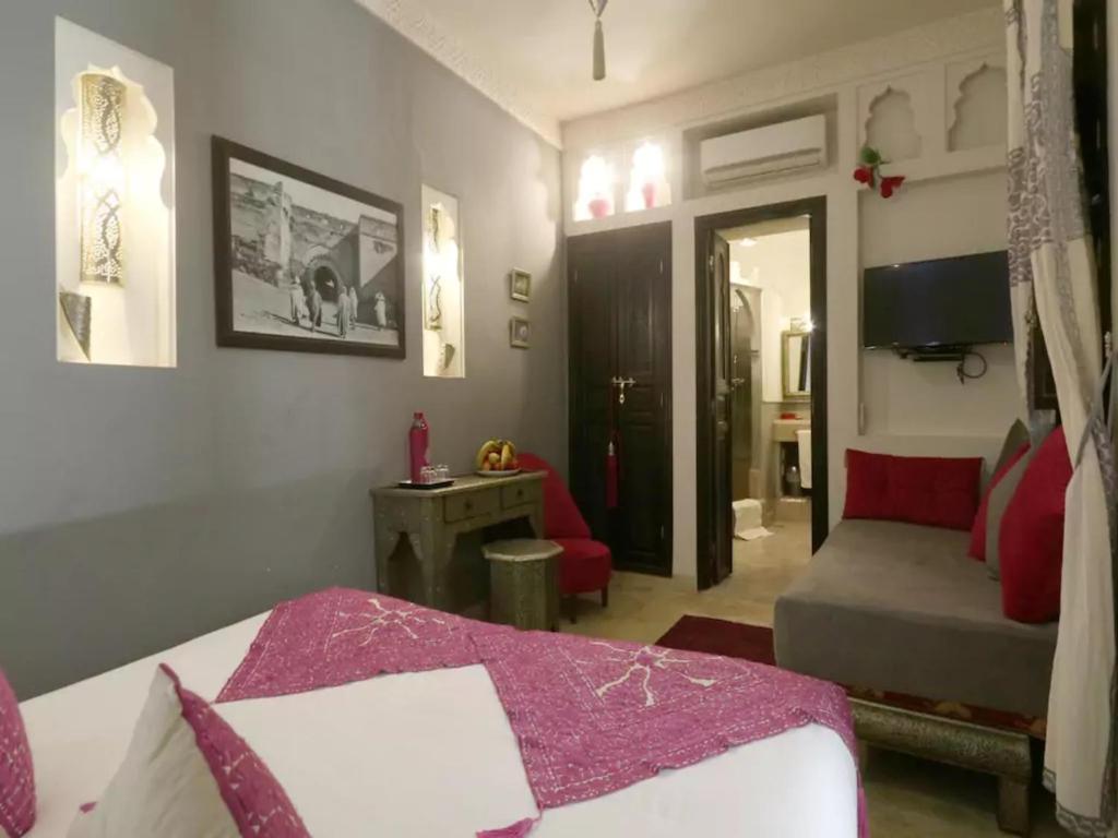 Postel nebo postele na pokoji v ubytování Riad Rêve d'Or