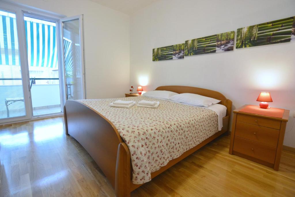 Кровать или кровати в номере San Apartment