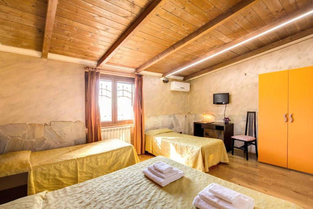 Postel nebo postele na pokoji v ubytování Villa Gengi