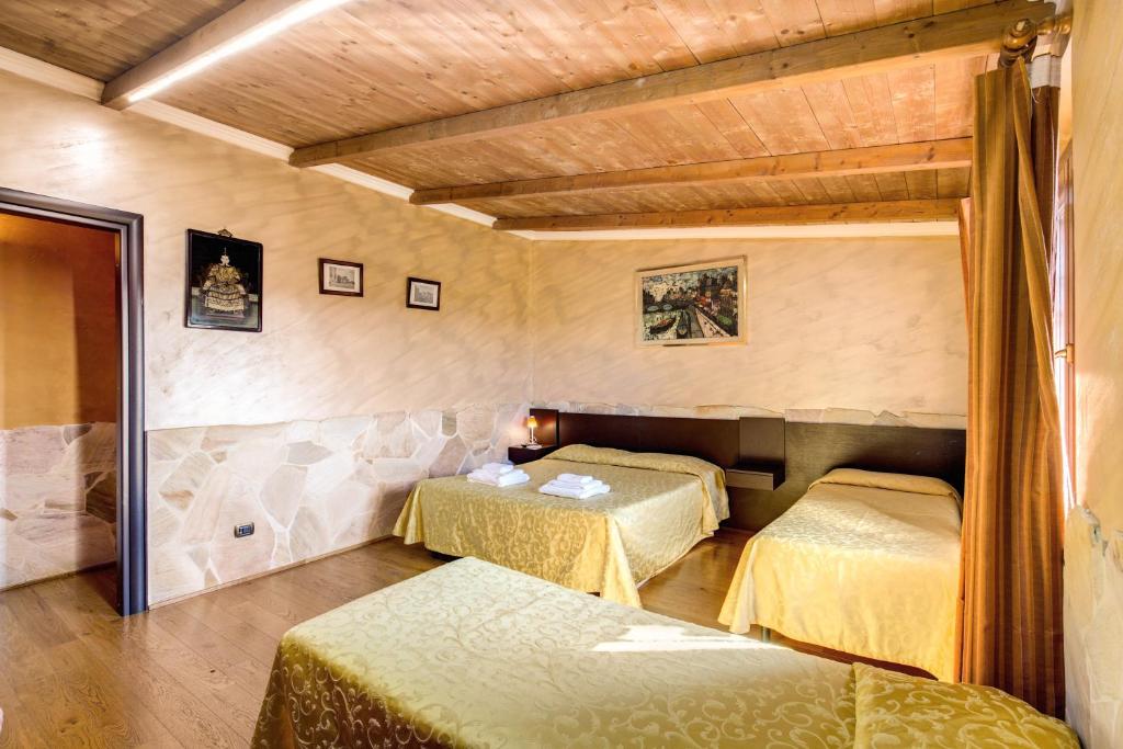Postel nebo postele na pokoji v ubytování Villa Gengi