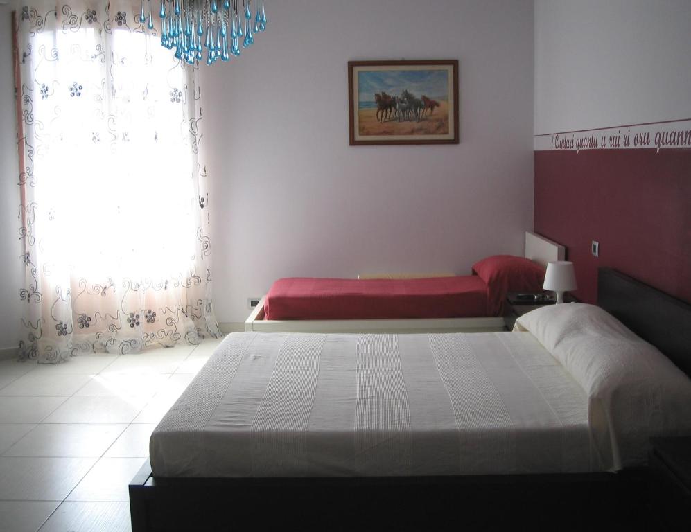 Postel nebo postele na pokoji v ubytování B&B Persi Nel Sud, Pozzallo