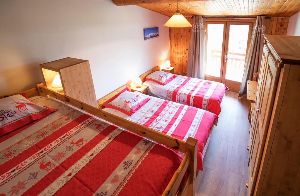 Postel nebo postele na pokoji v ubytování La Roche du Croue
