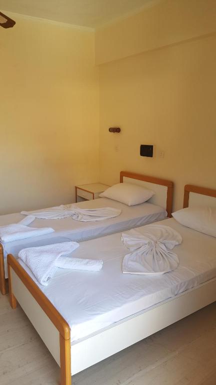 Postel nebo postele na pokoji v ubytování Moustakis Hotel
