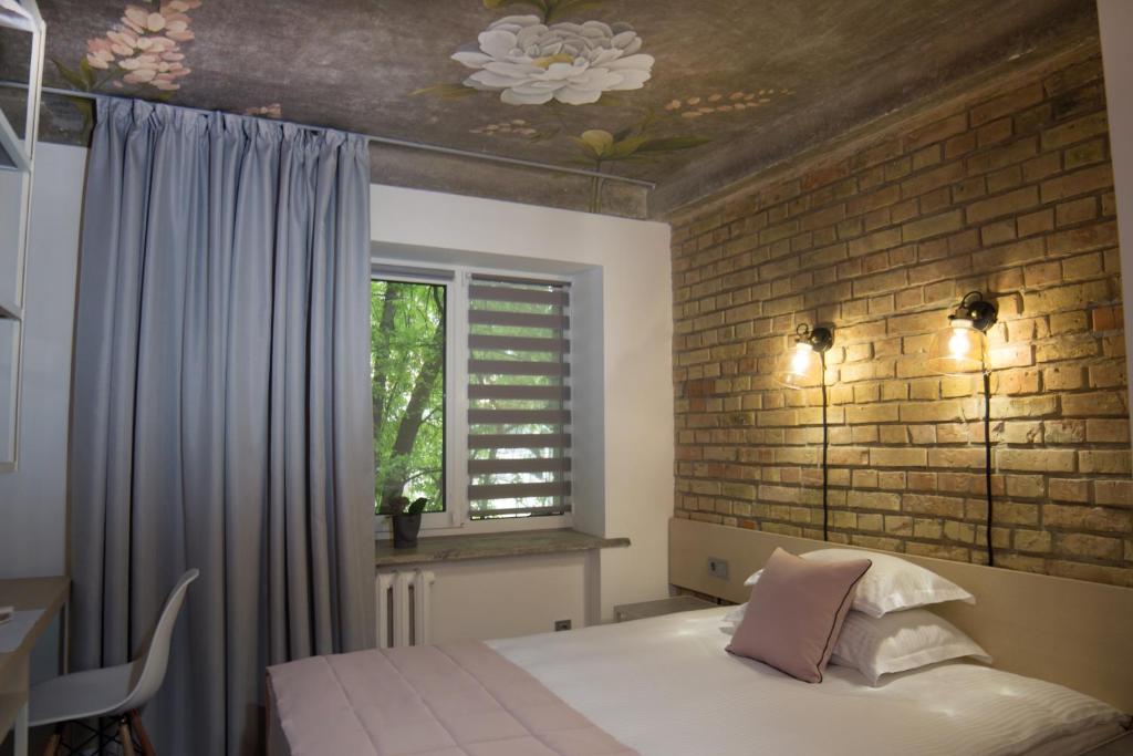 Postel nebo postele na pokoji v ubytování StanGret Hotel