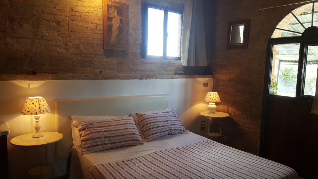 Postel nebo postele na pokoji v ubytování Casa Vacanze Fornace