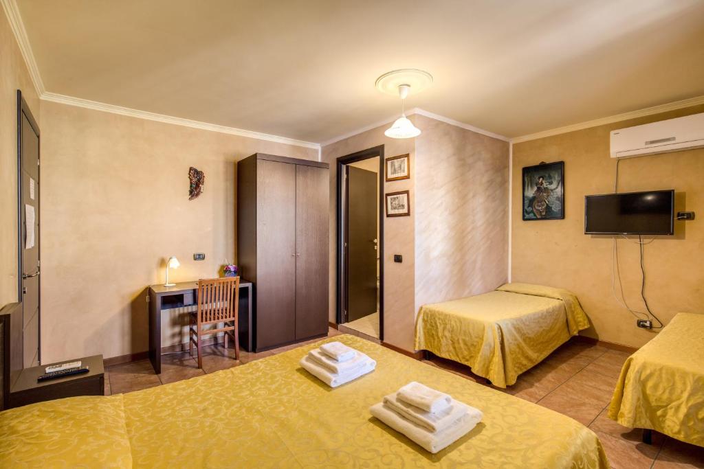 Postel nebo postele na pokoji v ubytování Villa Gengi