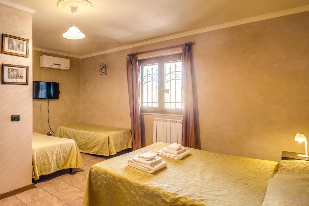 Postel nebo postele na pokoji v ubytování Villa Gengi