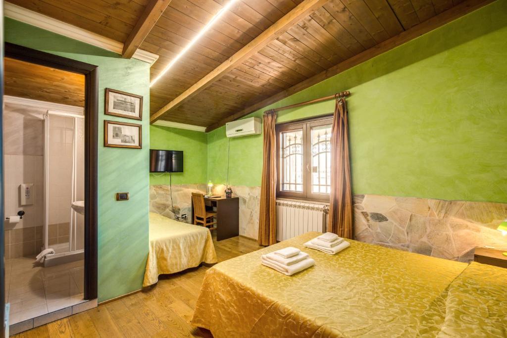 Postel nebo postele na pokoji v ubytování Villa Gengi