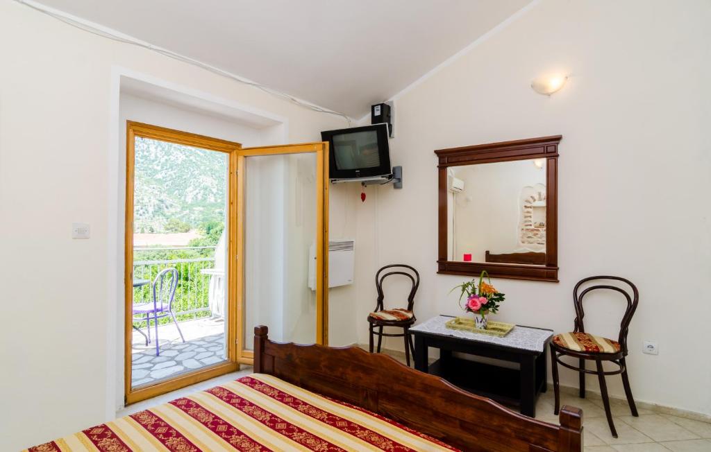 Postel nebo postele na pokoji v ubytování Apartments in Rustic House