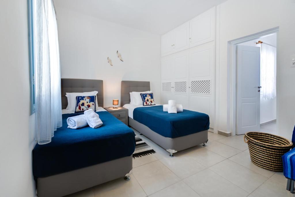 Postel nebo postele na pokoji v ubytování Folia Apartments