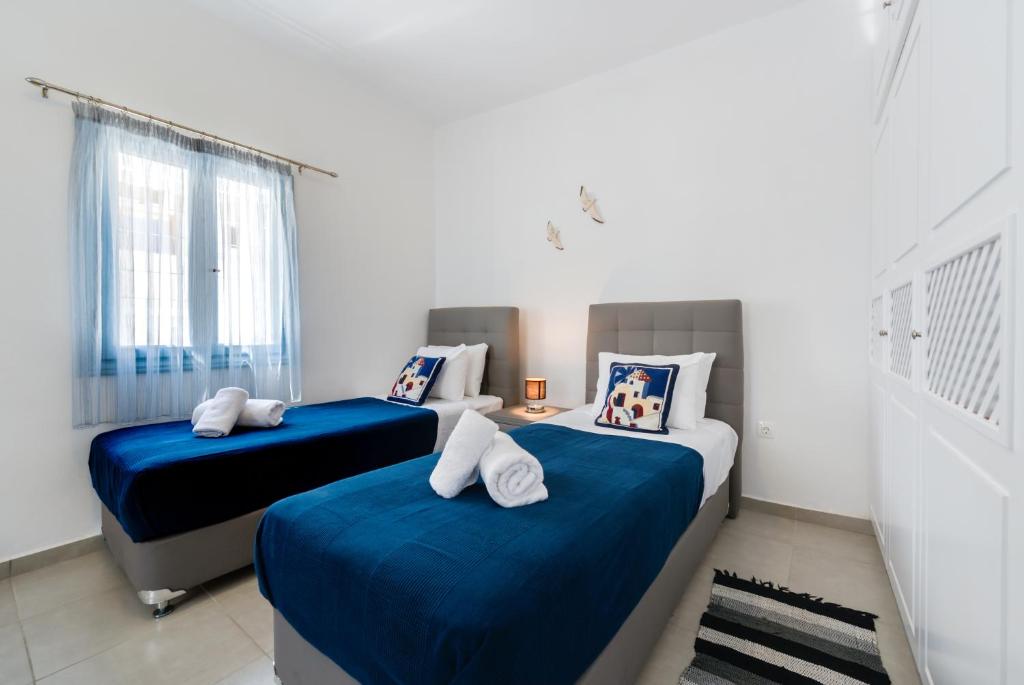 Postel nebo postele na pokoji v ubytování Folia Apartments